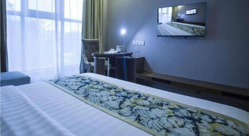Bed in GreenTree Inn Taizhou Gaogang District Business Hotel