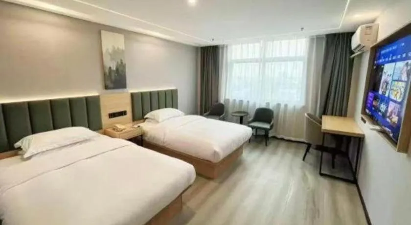 Bed in GreenTree Inn Taizhou Gaogang District Business Hotel