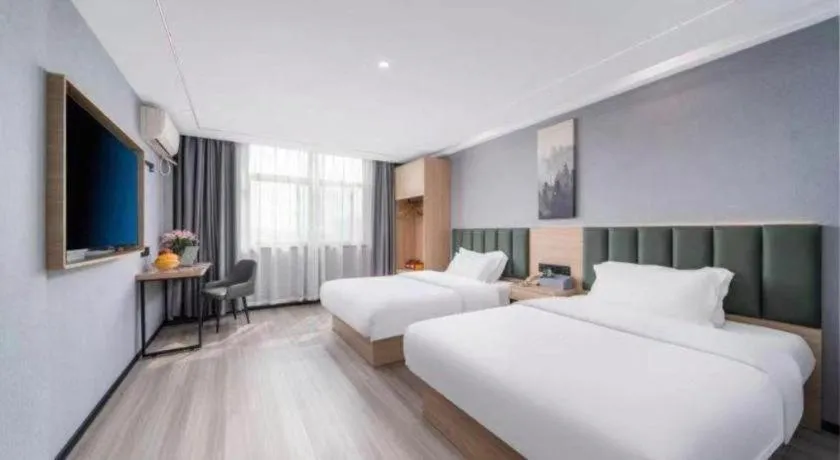 Bed in GreenTree Inn Taizhou Gaogang District Business Hotel