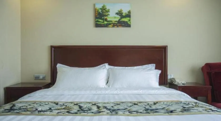 Bed in GreenTree Inn Taizhou Gaogang District Business Hotel