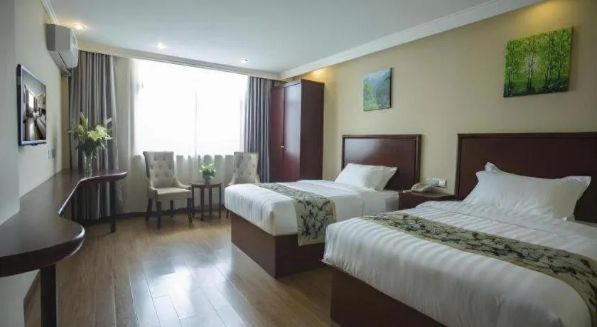 Bed in GreenTree Inn Taizhou Gaogang District Business Hotel