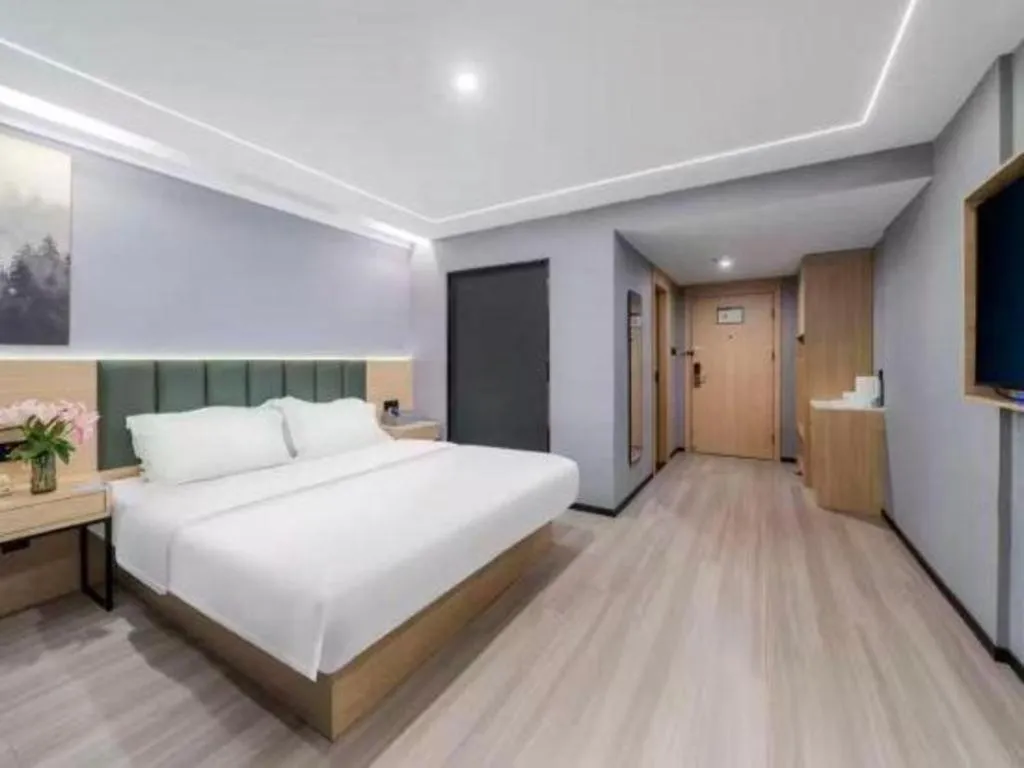 Bed in GreenTree Inn Taizhou Gaogang District Business Hotel