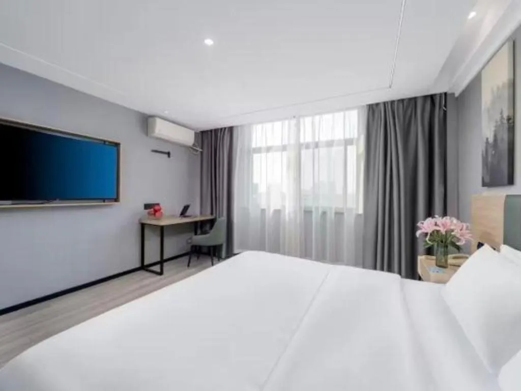 Bed in GreenTree Inn Taizhou Gaogang District Business Hotel