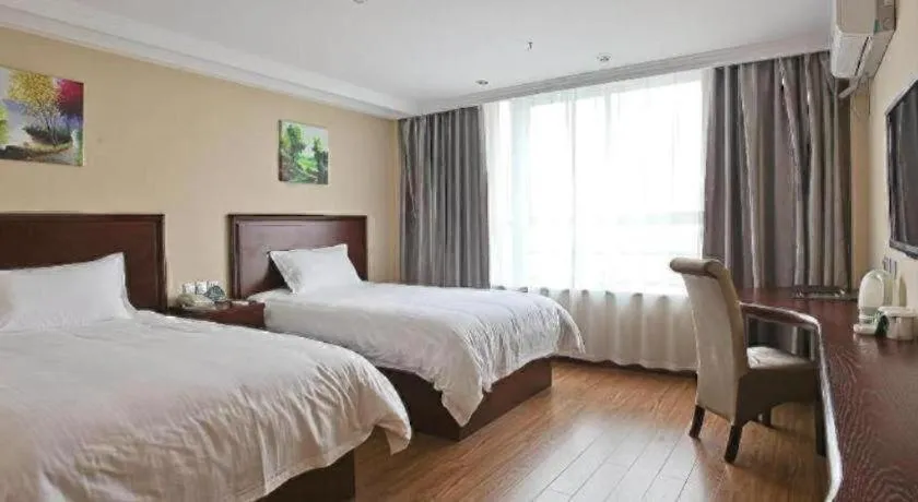 Bed in GreenTree Inn Taizhou Gaogang District Business Hotel