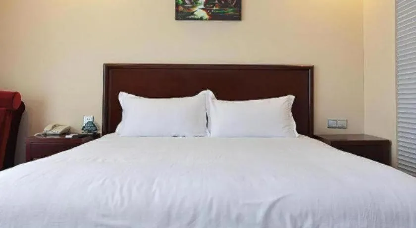 Bed in GreenTree Inn Taizhou Gaogang District Business Hotel