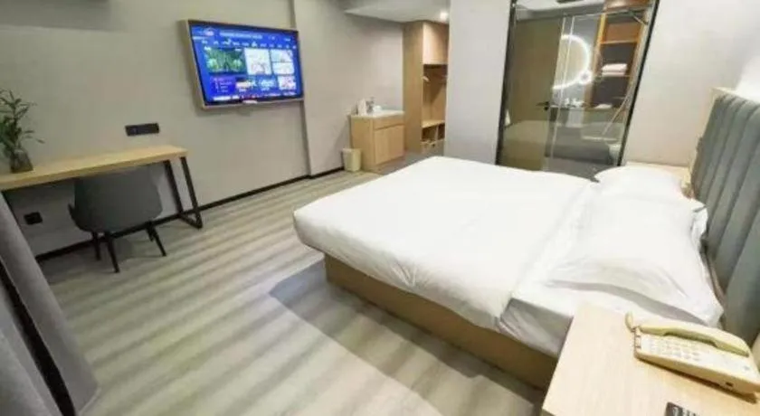Bed in GreenTree Inn Taizhou Gaogang District Business Hotel