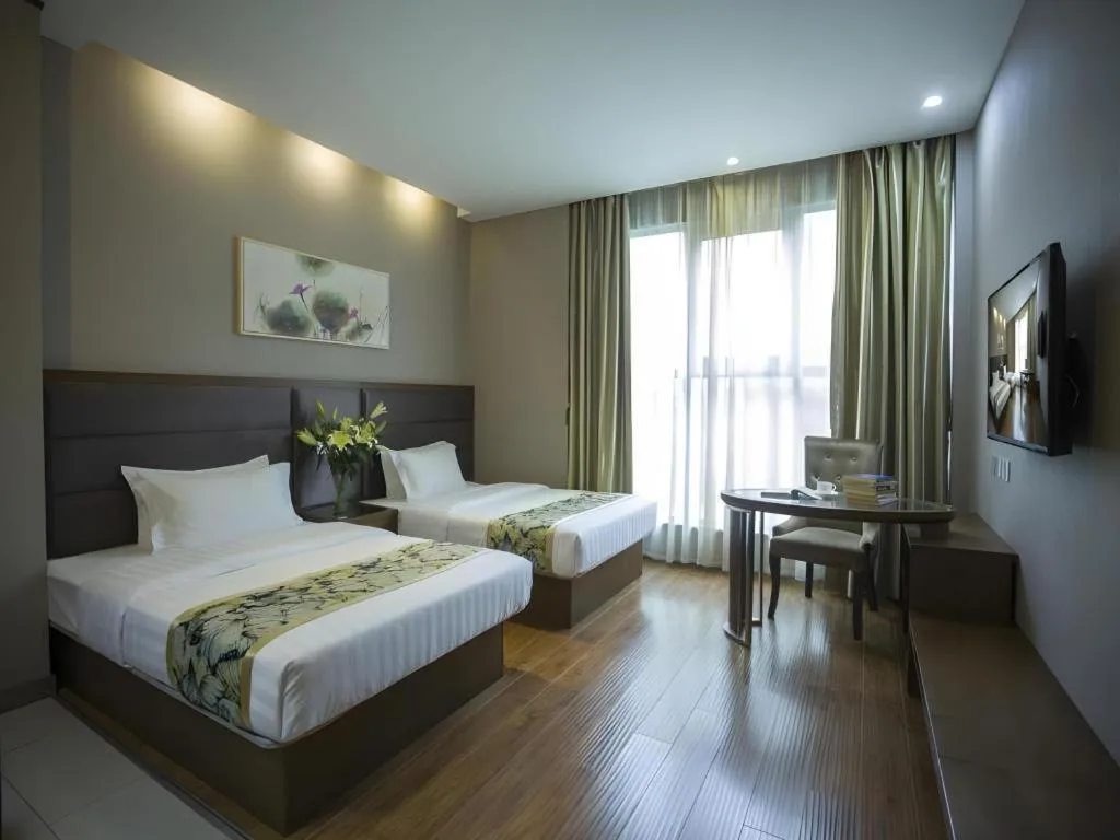 Bed in GreenTree Inn Taizhou Gaogang District Business Hotel