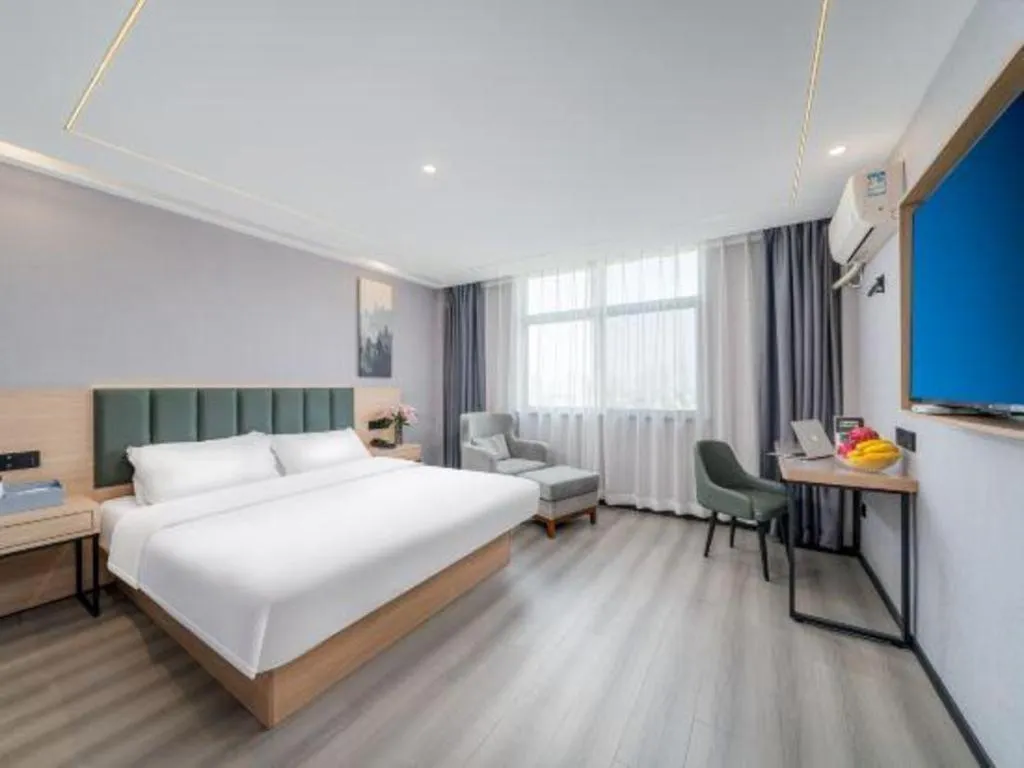 Bed in GreenTree Inn Taizhou Gaogang District Business Hotel
