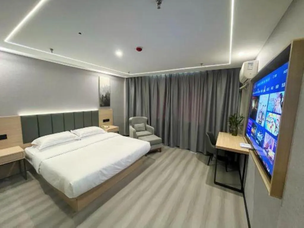 Bed in GreenTree Inn Taizhou Gaogang District Business Hotel