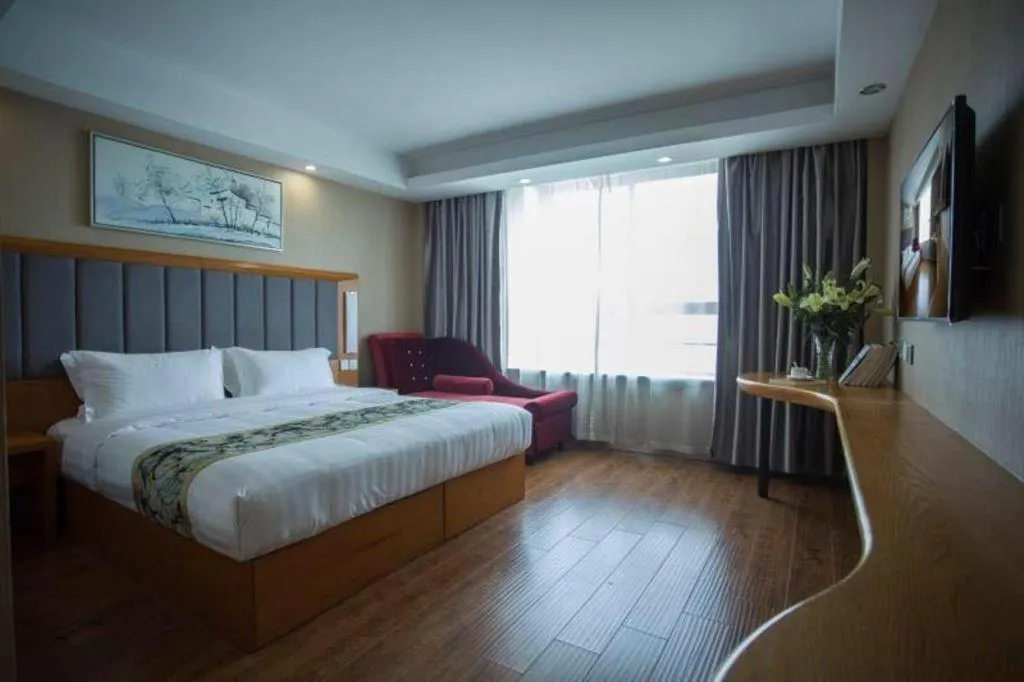 Bed in GreenTree Inn Taizhou Gaogang District Business Hotel