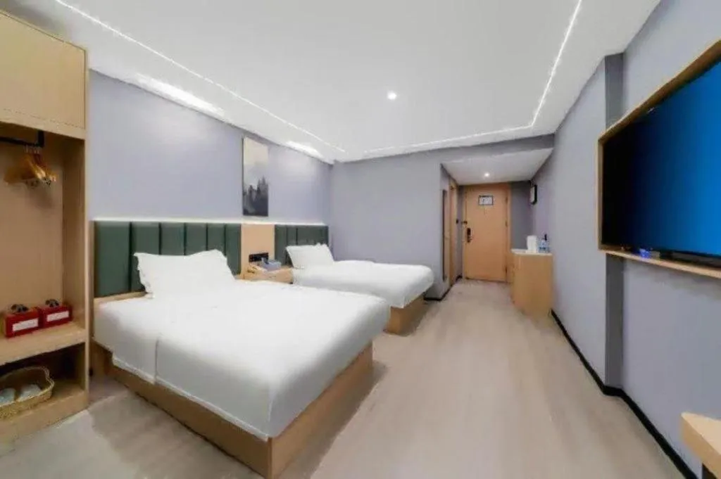 Bed in GreenTree Inn Taizhou Gaogang District Business Hotel