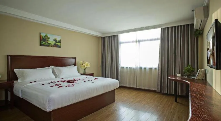 Bed in GreenTree Inn Taizhou Gaogang District Business Hotel