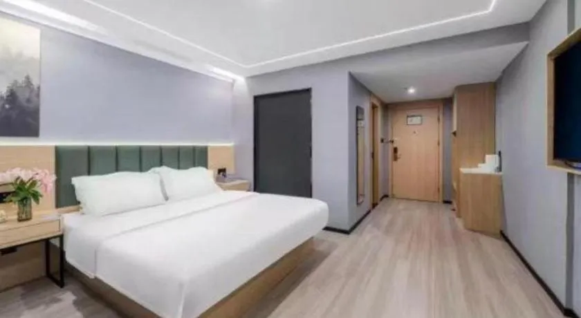 Bed in GreenTree Inn Taizhou Gaogang District Business Hotel