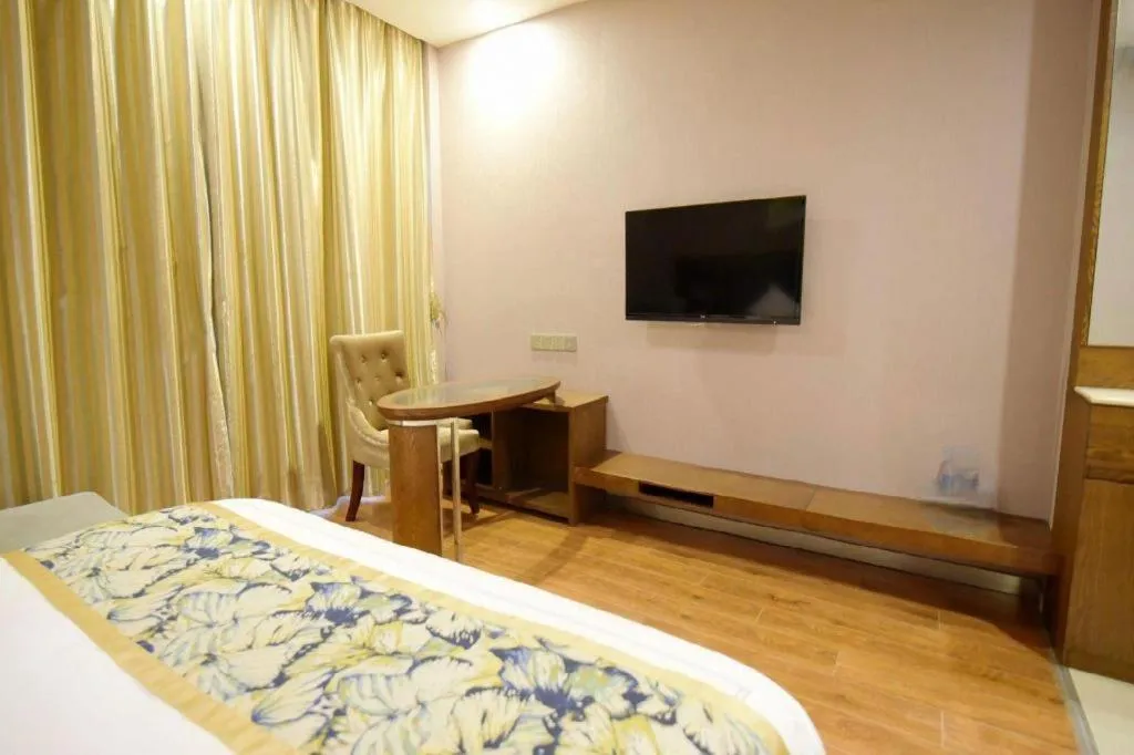 Bed in GreenTree Inn Taizhou Gaogang District Business Hotel