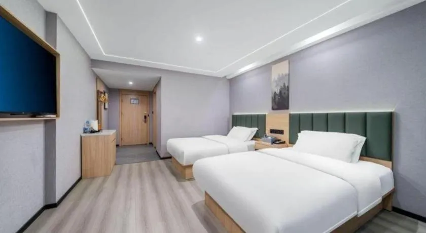 Bed in GreenTree Inn Taizhou Gaogang District Business Hotel