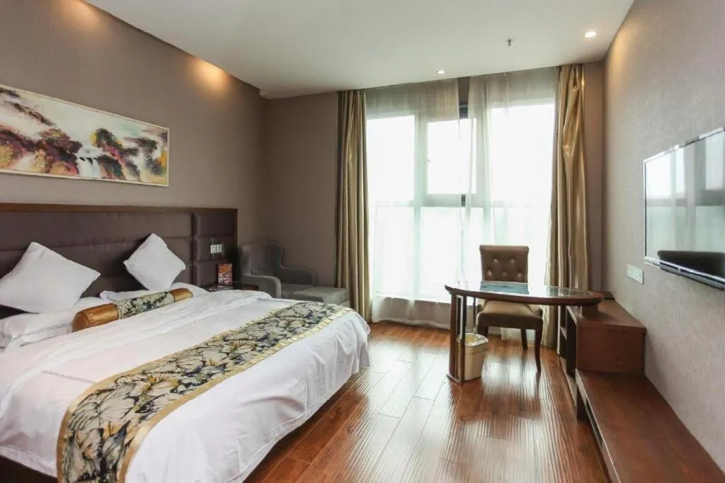 Bed in GreenTree Inn Taizhou Gaogang District Business Hotel