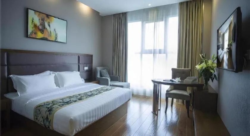 Bed in GreenTree Inn Taizhou Gaogang District Business Hotel