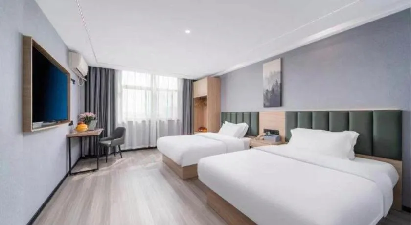Bed in GreenTree Inn Taizhou Gaogang District Business Hotel