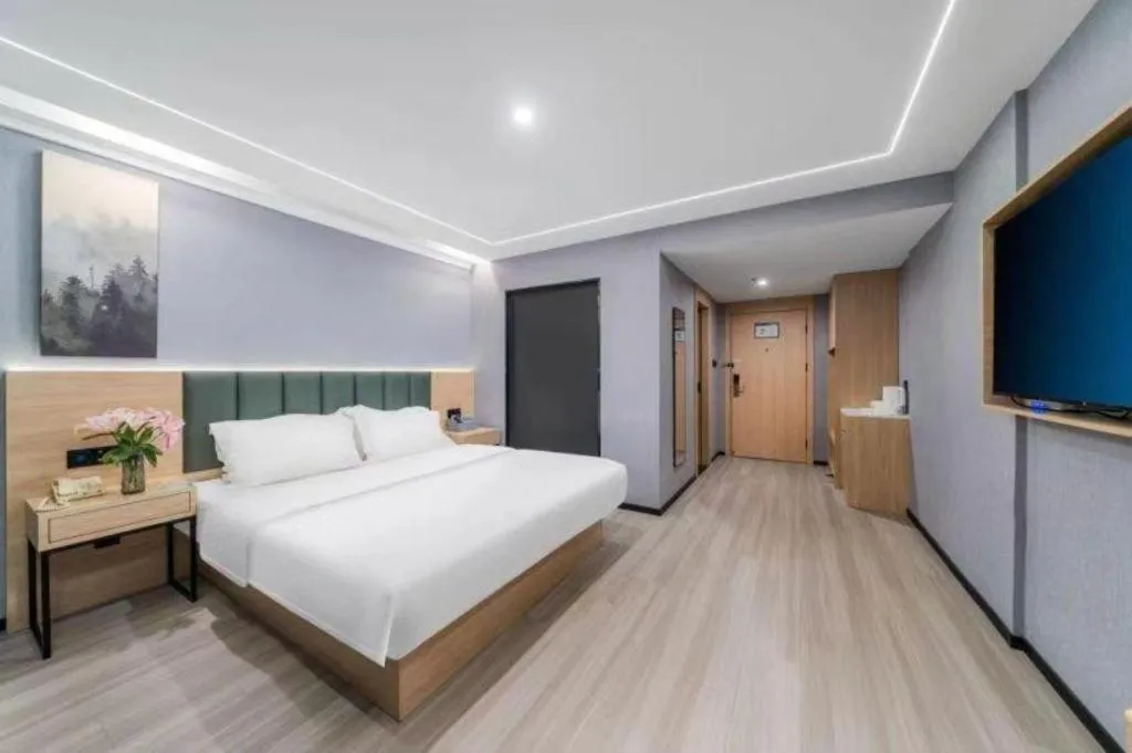 Bed in GreenTree Inn Taizhou Gaogang District Business Hotel