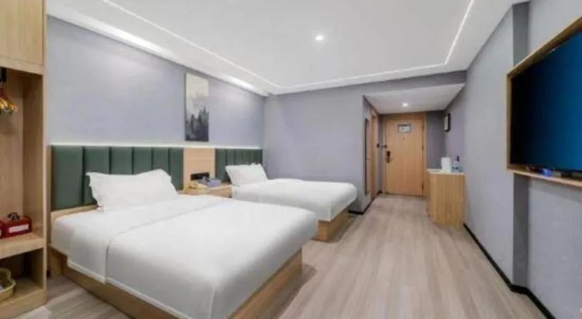 Bed in GreenTree Inn Taizhou Gaogang District Business Hotel