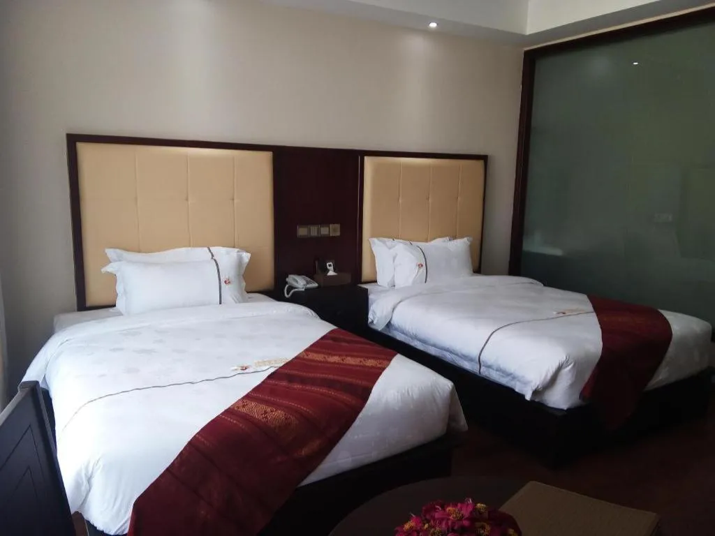 Bed in Xishuangbanna Hotel Managed by Xandria Hotel