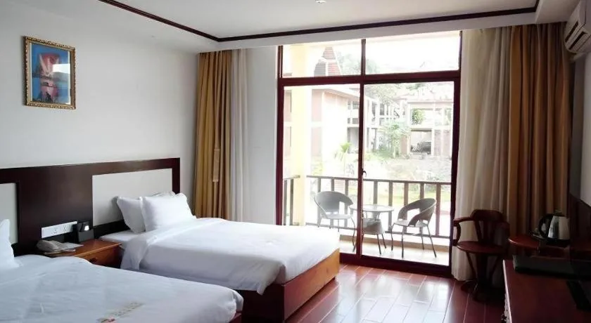 Bed in Xishuangbanna Hotel Managed by Xandria Hotel