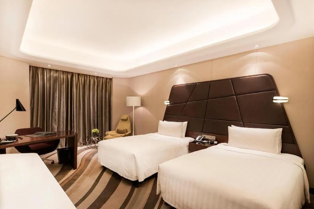 Bed in Hotel Maxmelim Beijing