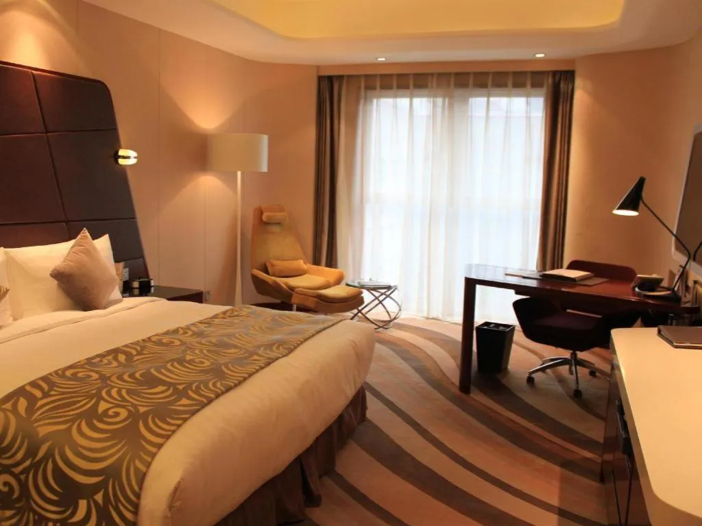 Bed in Hotel Maxmelim Beijing