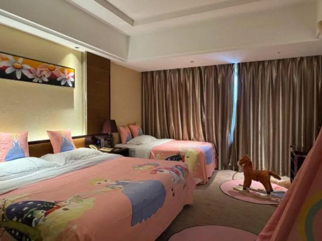 Bed in Xin Sheng Da Hong Sheng International Hotel
