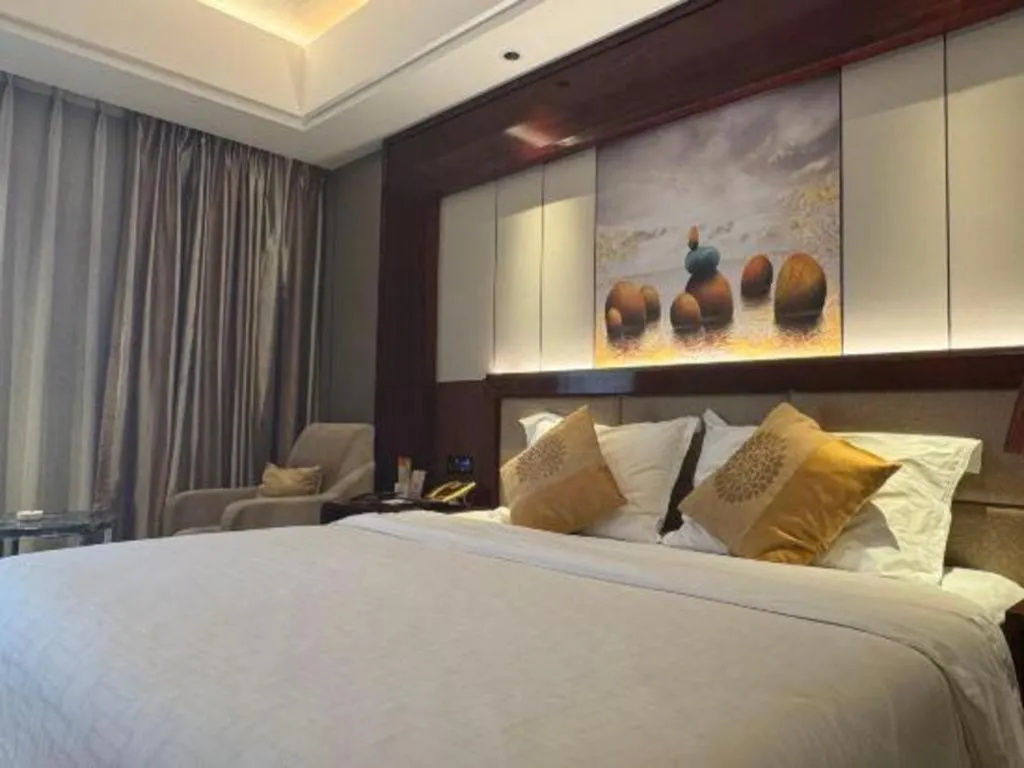 Bed in Xin Sheng Da Hong Sheng International Hotel