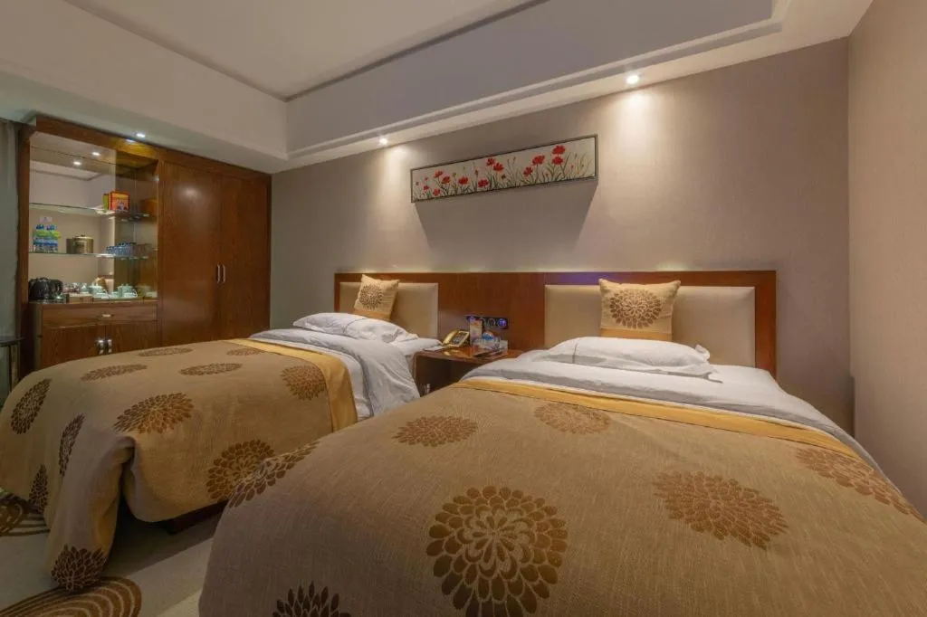Bed in Xin Sheng Da Hong Sheng International Hotel