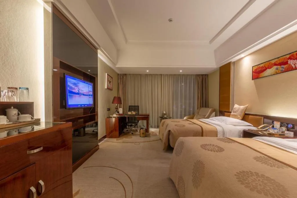 Bed in Xin Sheng Da Hong Sheng International Hotel