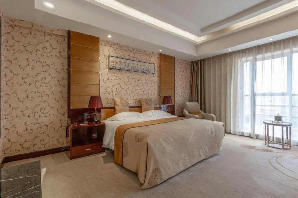 Bed in Xin Sheng Da Hong Sheng International Hotel