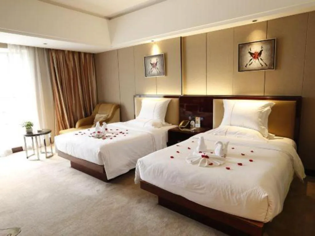 Bed in Xin Sheng Da Hong Sheng International Hotel