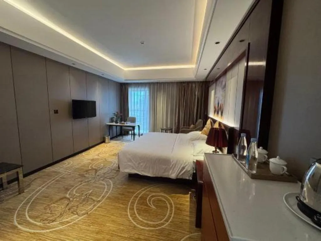 Bed in Xin Sheng Da Hong Sheng International Hotel