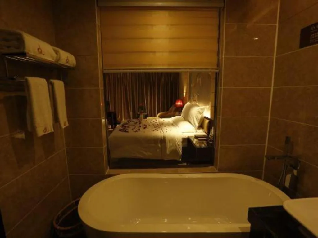 Bed in Xin Sheng Da Hong Sheng International Hotel