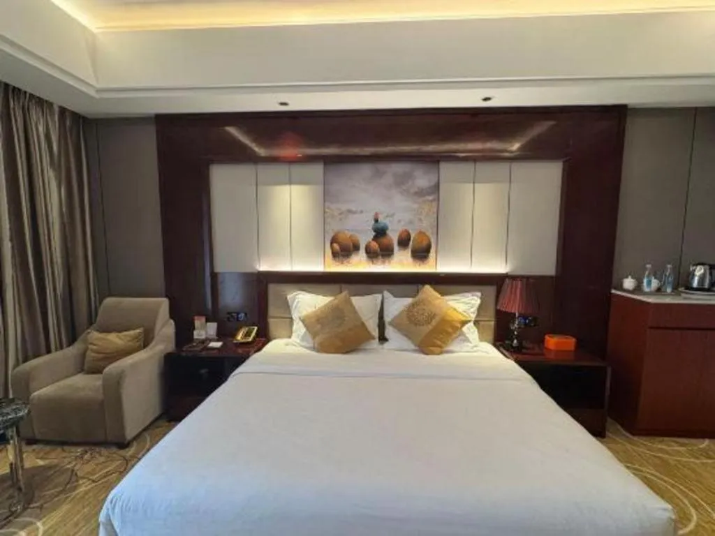Bed in Xin Sheng Da Hong Sheng International Hotel