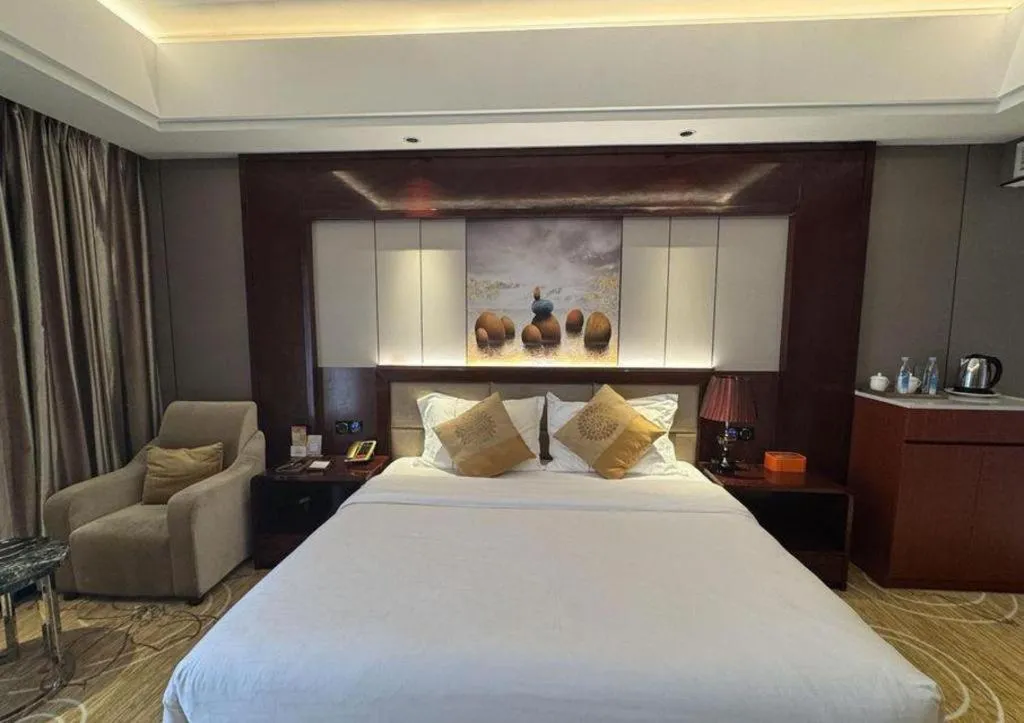 Bed in Xin Sheng Da Hong Sheng International Hotel