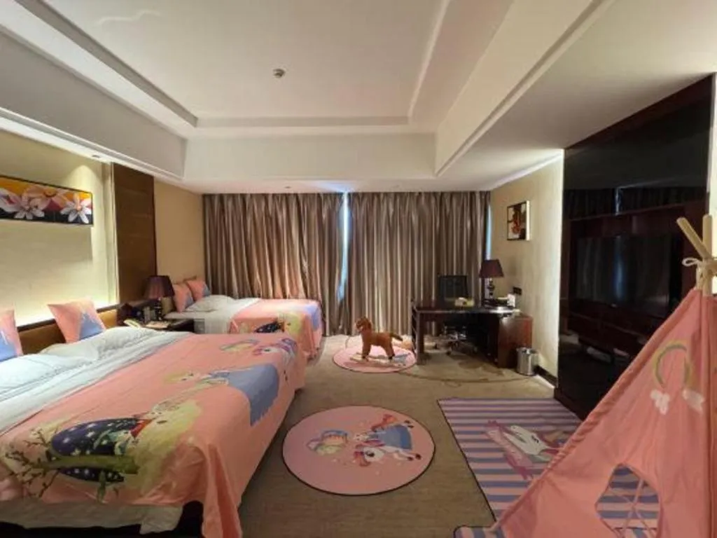 Bed in Xin Sheng Da Hong Sheng International Hotel