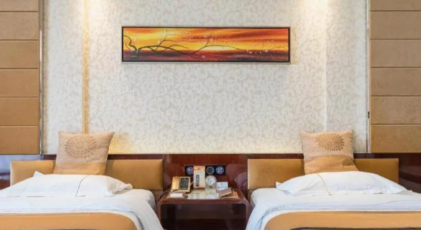 Bed in Xin Sheng Da Hong Sheng International Hotel