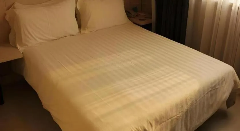 Bed in Jinjiang Inn Beijing Huairou Qingchun Road Wanda Plaza
