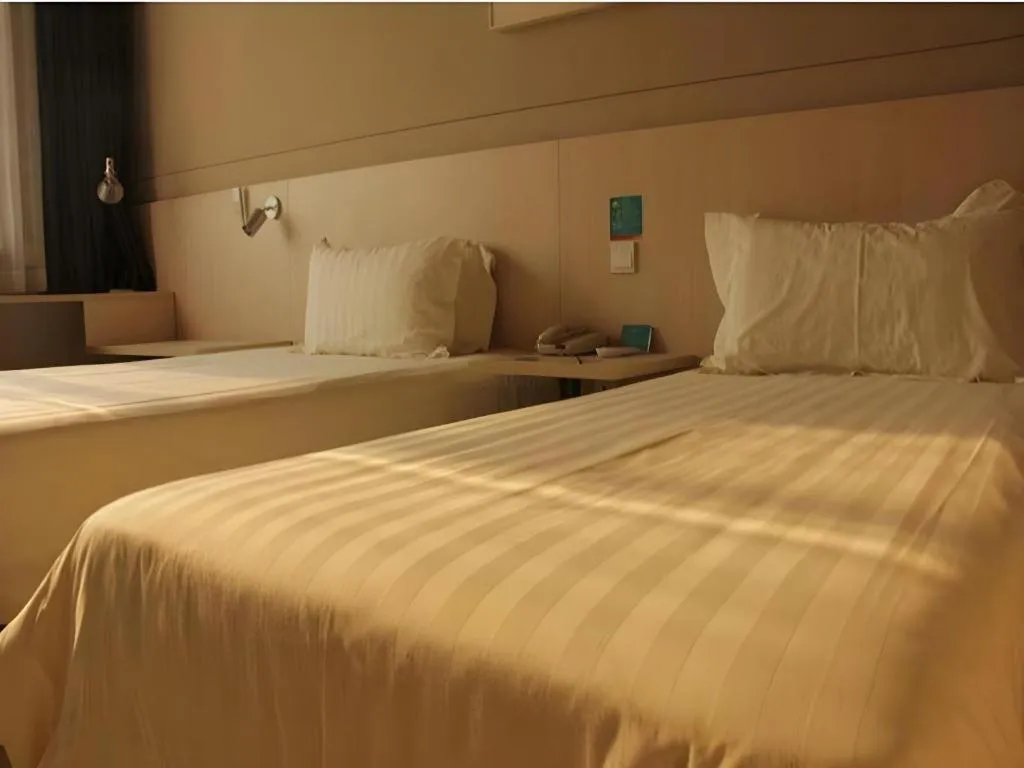 Bed in Jinjiang Inn Beijing Huairou Qingchun Road Wanda Plaza