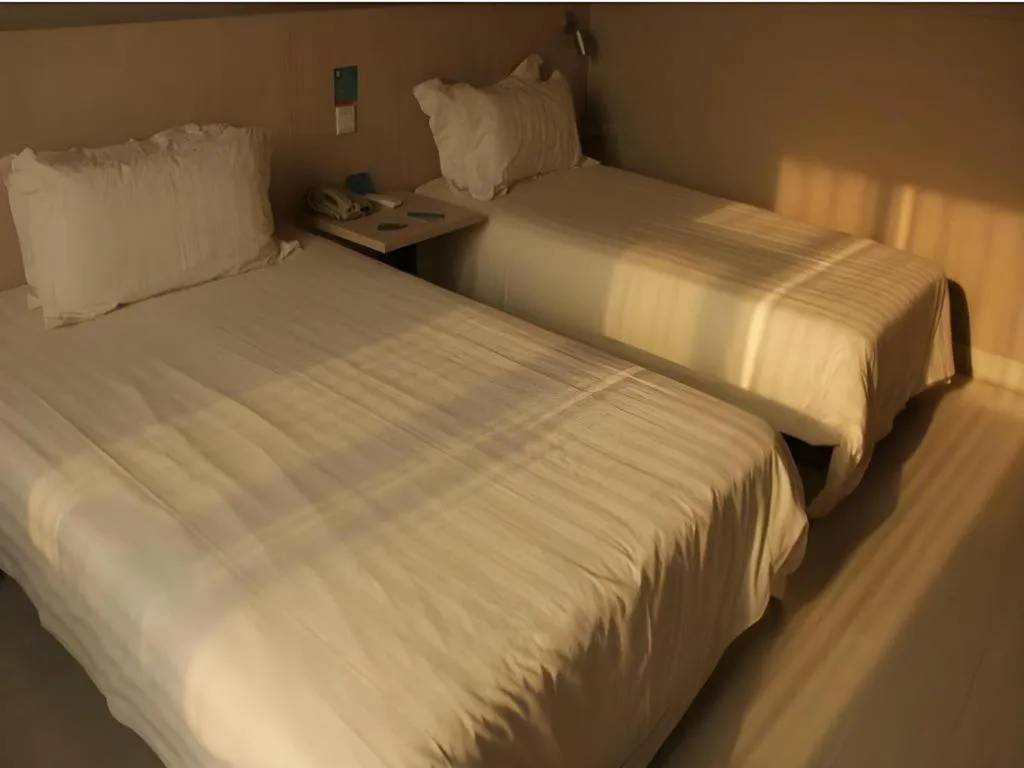 Bed in Jinjiang Inn Beijing Huairou Qingchun Road Wanda Plaza