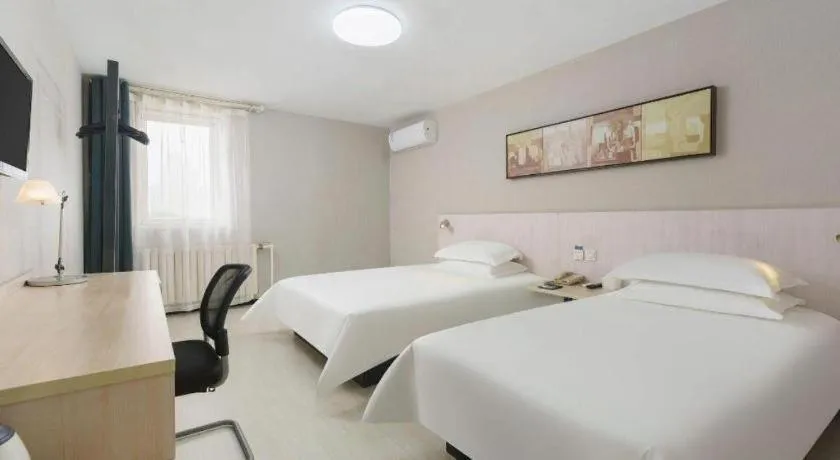 Bed in Jinjiang Inn Dalian Development Zone Jinma Road Light Railway Station