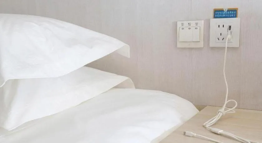 Bed in Jinjiang Inn Dalian Development Zone Jinma Road Light Railway Station