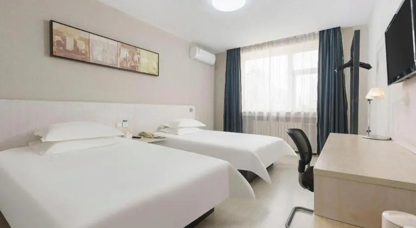 Bed in Jinjiang Inn Dalian Development Zone Jinma Road Light Railway Station