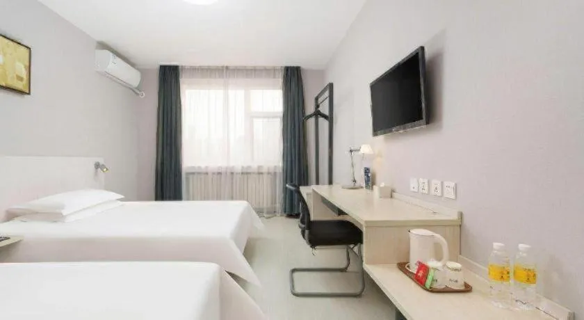 Bed in Jinjiang Inn Dalian Development Zone Jinma Road Light Railway Station