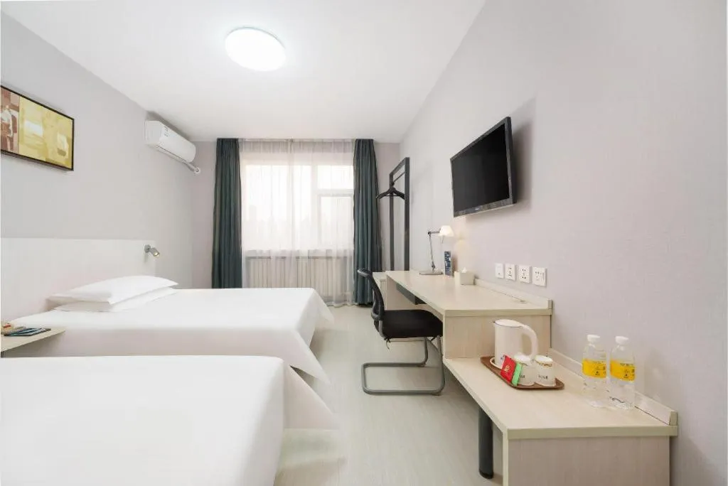 Bed in Jinjiang Inn Dalian Development Zone Jinma Road Light Railway Station