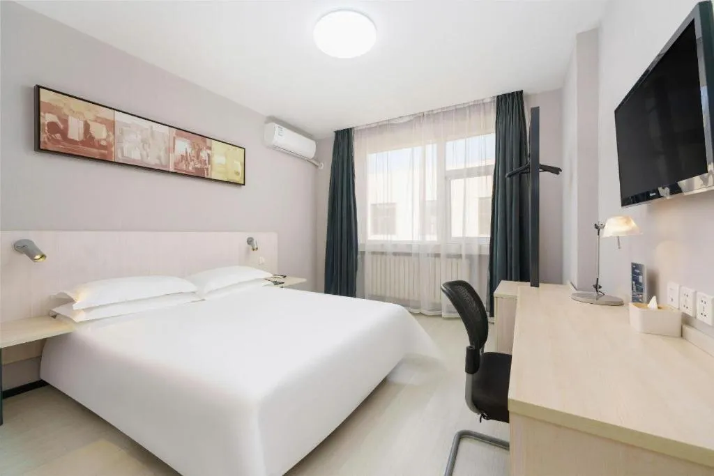 Bed in Jinjiang Inn Dalian Development Zone Jinma Road Light Railway Station