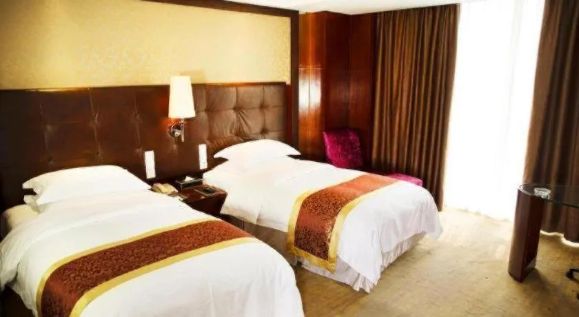 Bed in Maison New Century Hotel Wuyuan Haiyan